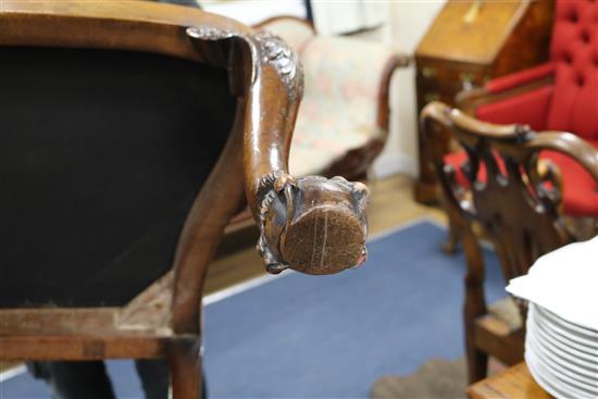 A pair of George I style walnut elbow chairs